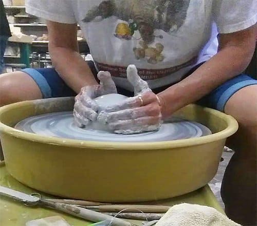 a picture of A Potter Centering clay