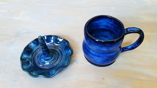 a picture of a glazed fired mug and ring holder