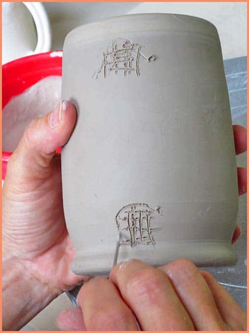 a picture of a potter scoring a mug