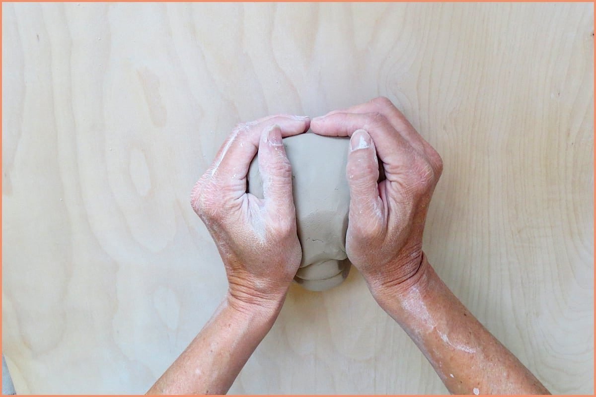 a picture of a potter with thumbs on top of the ram's head wedge