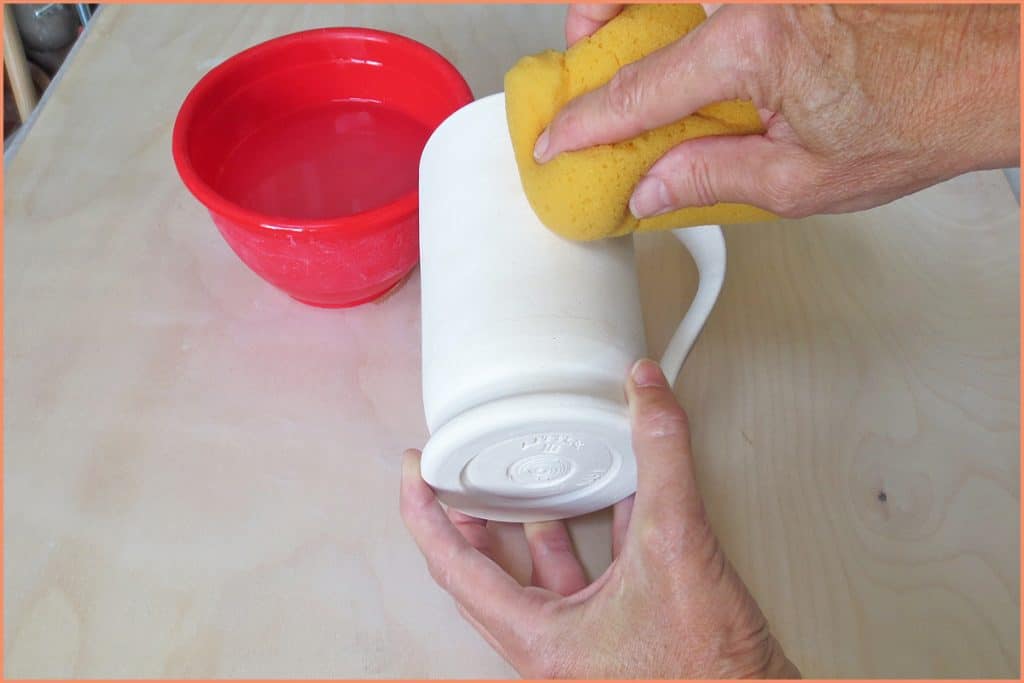 a picture of a potter sponge cleaning a mug