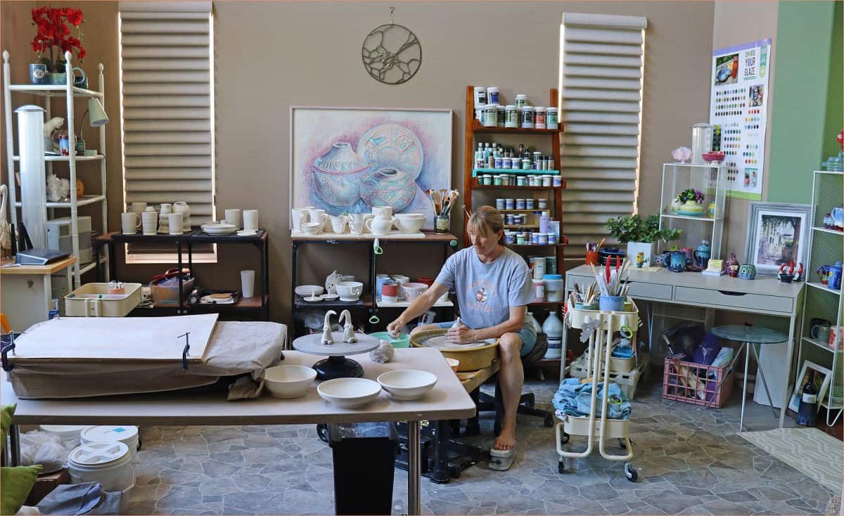 a picture of a potter in a home pottery studio