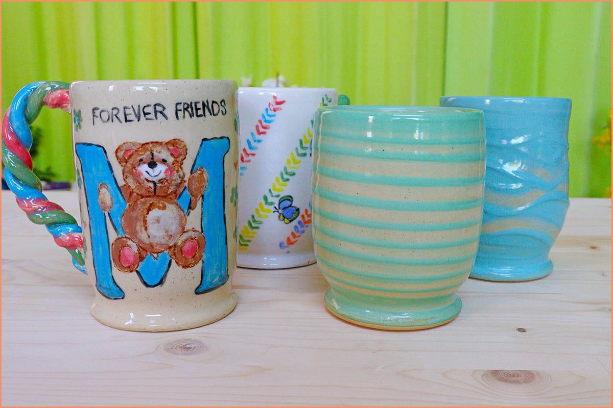 a picture of underglaze and slip mugs