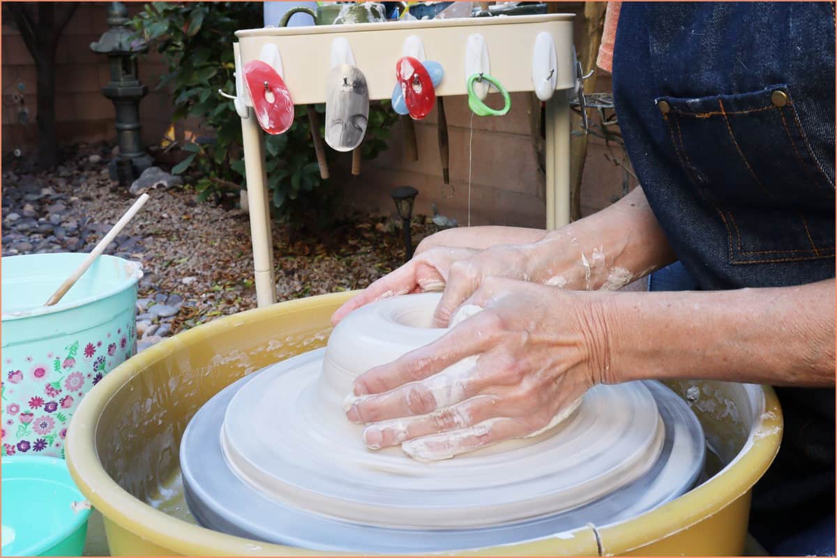 picture of a potter opening clay
