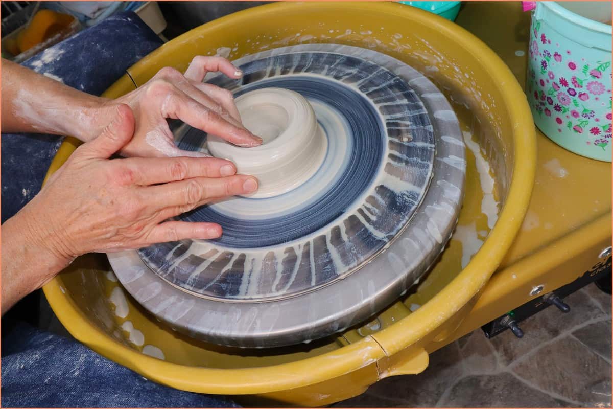 Image of a potter throwing counter clockwise