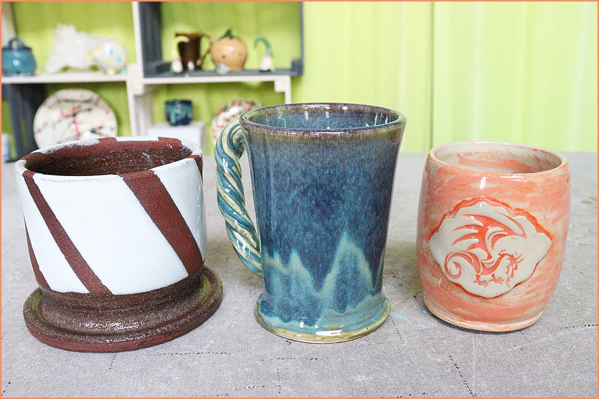 an image of 3 glaze resist mugs