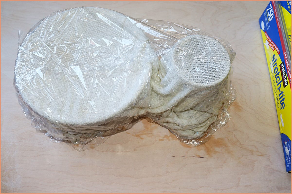 An Image of pottery wrapped in a cloth and wrap in plastic wrap