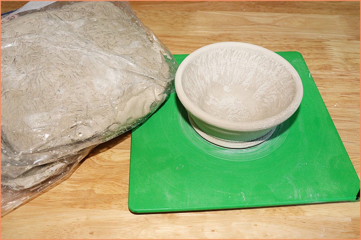 An Image of Frozen clay in bag and on bat