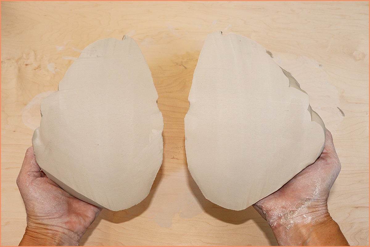 An Image of a potter holding a Split Spiral wedge
