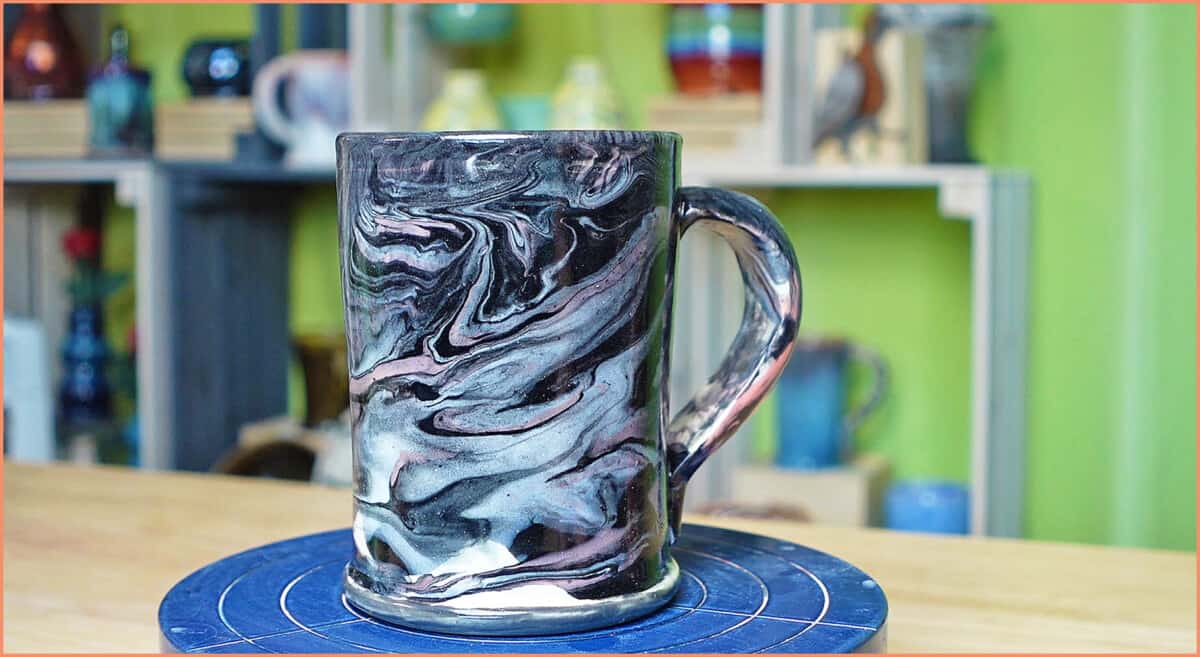 an image of finished black white and pink split cup mug
