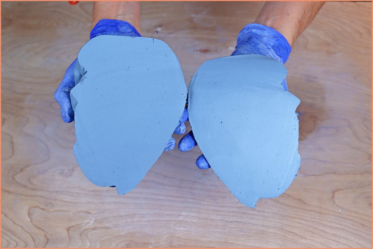 an image of of a potter holding mixed colored clay