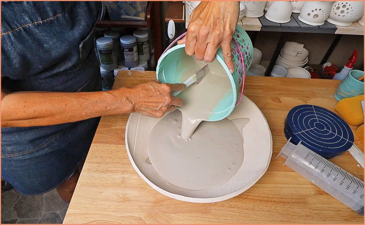 pour clay water in bisqued bowl