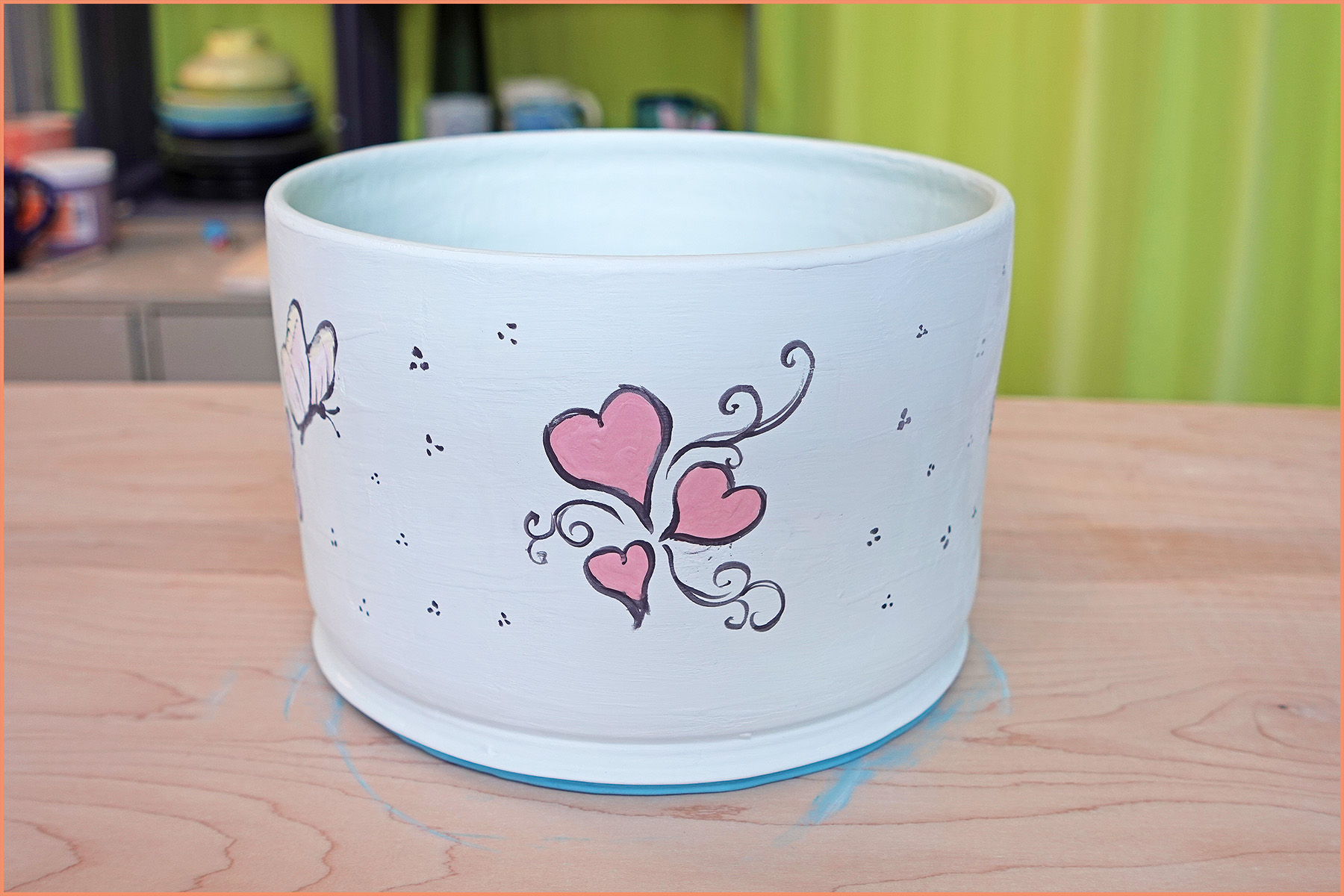 an image of a bisqueware planter underglazed with hearts