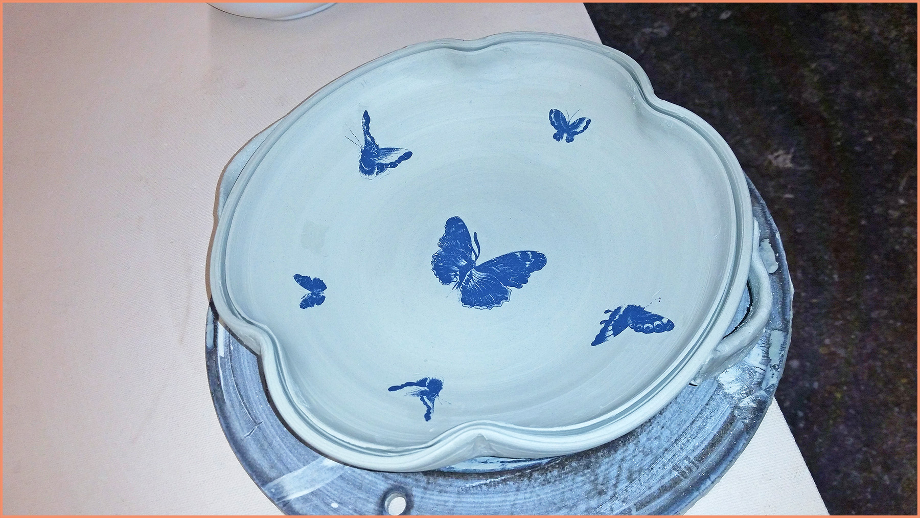 an image of butterfly transfers on leather hard clay