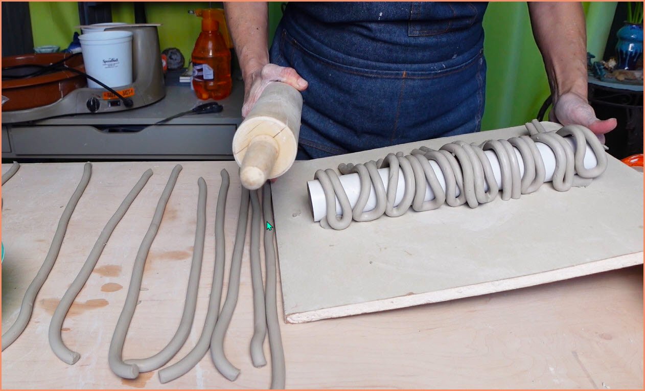 an image of clay coil handles on a ware board