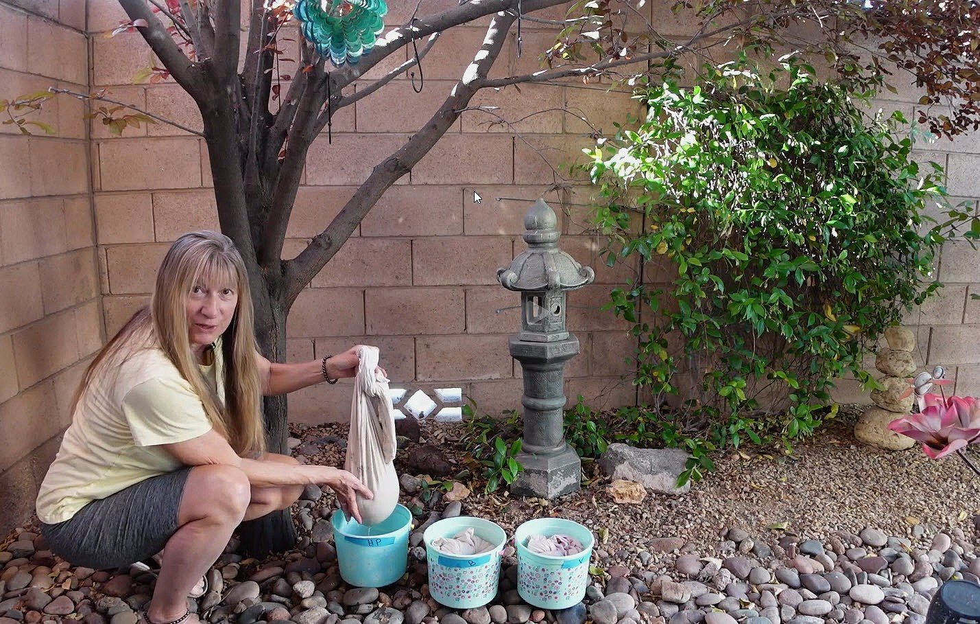 How to Remove Mold from Clay: Best Ways to Save Moldy Pottery Clay holding the pillowcase with clay above the bucket of water